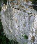 A climber makes his way up the first pitch