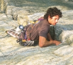 Close-up of Joe climbing the crack above the crux on Retribution