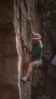 Bouldering up the start of Susie A (5.10+)