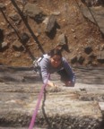 Lucie climbs juggy rock on Frogs Head