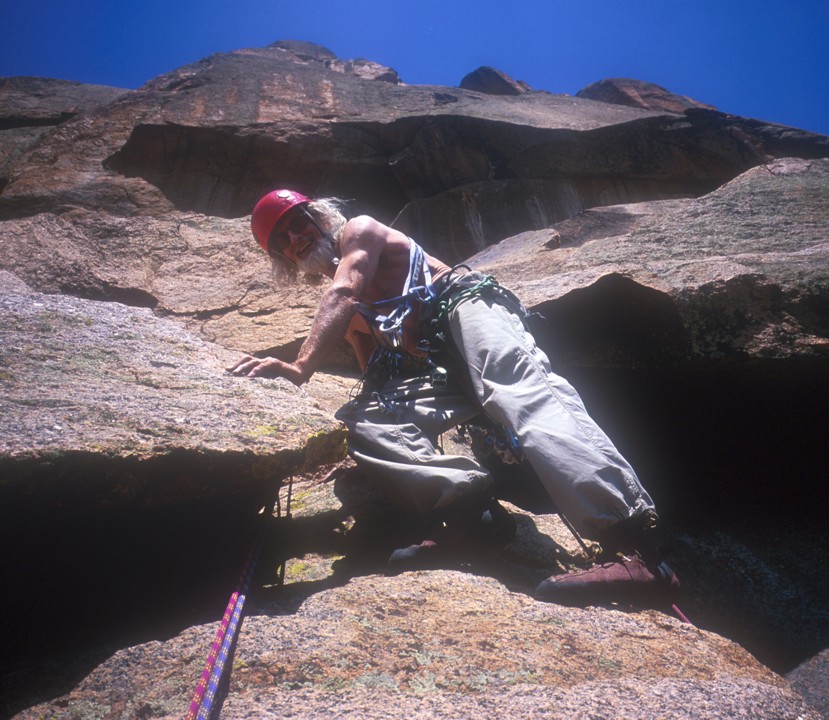 After making the crux moves, Tommy looks down for the camera