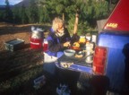 Preparing breakfast; keg in the background