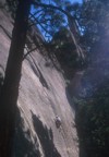 Lee works his way through the crux flakes at the start of The Standard; Mioara and Tommy start up another route in the foreground