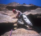 After making the crux moves, Tommy looks down for the camera