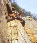 Placing gear at the top of the corner before heading into the crux section; lots of small wires required