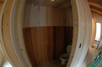 The toilet closet was paneled with cherry scraps down low and maple up higher