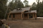 Exterior scaffolding for building the chimney above the roof