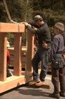 Doug and Nancy prep the floor section before it is raised into position