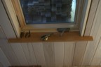 The first window extension jamb and sill installation in the bathroom
