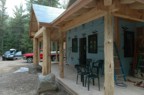 The completed front porch -- 2x4 T&G white cedar floor, 2x6 T&G white cedar ceiling, cedar posts, and pine timber framing