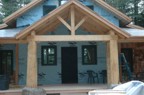 Completed front porch seen from the north with the large columns resting on boulders moved from elsewhere on the property