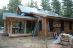 Front porch seen from the west; there is a hole where the chinney will soon appear through the roof