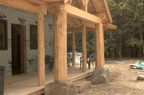 Front porch posts demonstrating the careful scribing where the posts meet the rock