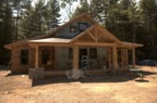 The siding begins to creep around the house and onto the porch