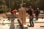 Crew members prepare the floor section to be raised into position