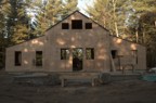 The Hut enclosed in plywood, seen from the front