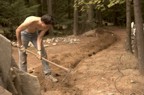 Jim digs the trench for the phone cable on a hot, sweaty day