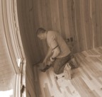 Johnny finishes the final corner of flooring in the bedroom