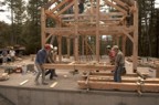 Continuing to move the rafter subsection, Doug helps, Jou and Doug watch