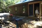 The floor of the outdoor shower is drained via PVC pipe to the hillside