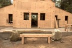 The large boulders are to receive the porch posts