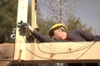 Richard attaches a comealong to pull sections of the frame together