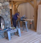 Schelly cuts flooring on the chop saw