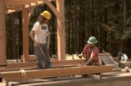 Joe and Steve prepare the rafter subsections that surround the chimney