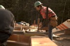 Steve applies straps to a frame section to move with the crane