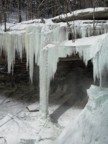 The reliable pillar to the left of the main waterfall