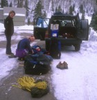 Fanni stands around while Nikos and Jim get changed in the road