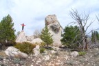 Standing on a large boulder at the high end of the Main Wall